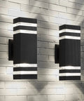 Slick Modern Black Outdoor Wall Light Two Pack Weatherproof Exterior Sconce mounted on brick wall
