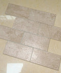 Peel And Stick Stone Tile Backsplash Kit, 10 Sheets, Subway Roman Travertine Veneer on floor, showcasing texture and style