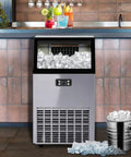 No Fuss Heavy Duty Countertop Ice Maker With Smart Led Panel And Hella Fast Freeze Cycle That Drops Forty Five Kilos Of Perfect Cubes Twenty Four Hours Flat Including Faucet Hookup And Scoop For Any Kitchen Or Bar Setup showing stainless steel design with ice cubes.