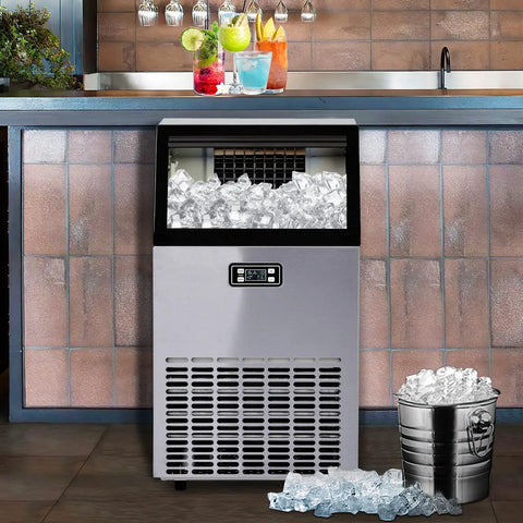 No Fuss Heavy Duty Countertop Ice Maker With Smart Led Panel And Hella Fast Freeze Cycle That Drops Forty Five Kilos Of Perfect Cubes Twenty Four Hours Flat Including Faucet Hookup And Scoop For Any Kitchen Or Bar Setup showing stainless steel design with ice cubes.