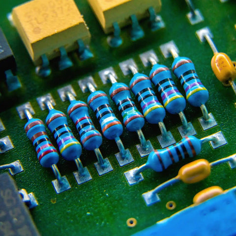 Close-up of resistors on a circuit board from One Watt Metal Film Resistor Kit With Forty Distinct Values And Four Hundred Pieces...