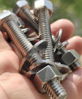 Tough-As-Nails 3/8-16 X 5 Stainless Steel Hex Bolts With Nuts, Flat And Lock Washers, 18-8 304 Stainless in hand outdoors