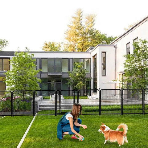 Woman playing with dog near Tall Garden Fence 36 Inch High 10 Panel Heavy Duty Metal Dog Fence for Yard Outdoor Pet Playpen, house in background.