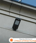 Powerful 12-Watt Waterproof Outdoor Solar Security Light With PIR Motion Sensor And Timer mounted on a building wall