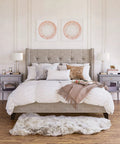 Bedroom with Tall 27 Inch Table Lamp With White Fabric Shade And Seeded Glass Base In Blackened Bronze Finish on nightstands