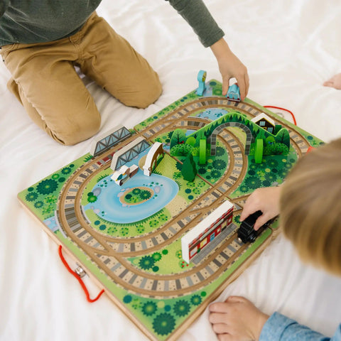 Portable Wooden Railroad Tabletop Playset With Magnetic Train Cars And Animal Scenery For Toddlers And Preschoolers Age Three Plus Legit Awesome Travel Kit, kids playing with train and landscape.