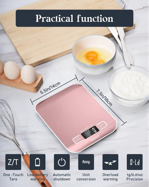 Slim Digital Kitchen Scale With 11Lb Capacity, pink, LCD display next to eggs, measuring flour, whisk, in kitchen setting.
