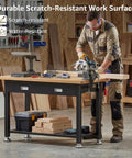 Craftsman using Beast Heavy Duty Work Bench With Drawer And Storage For Garage And Shop, cutting wood on small wood top.