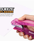 Hand using EZ Squeeze Reduced Effort One Hole Punch For The Office with ergonomic grip and no-jam technology, punching paper