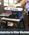 Pro Grade Stand For 10 Inch Band Saw, Heavy Duty Steel Frame Weighing 12.5 Lbs, Lightweight Yet Rugged, Non Slip Feet For Rock Solid On Site Stability, Easy To Carry Anywhere, Perfect For Pros And DIY Projects supporting a sanding machine in use.