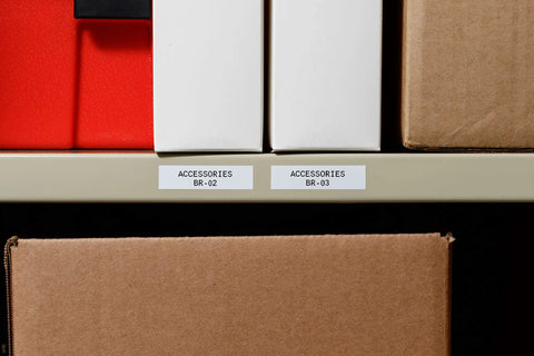 All Weather Vinyl Label Tape Built To Handle Heavy Duty Work And Lab Marking Sticks Like Wild In Freezers Or Extreme Cold Black On White Tape on labeled storage boxes.