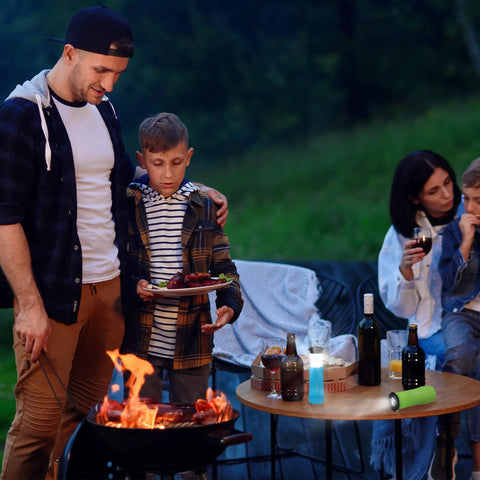 Two In One Mini Lantern And Flashlight Zoomable Portable Light on table at camping barbecue with family