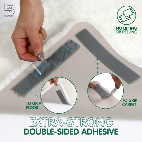 Person applying Non Slip Rug Grippers For Area Rugs Pack Of 9 Reusable Washable Anti Slip Corner Pads With Double Sided Tape