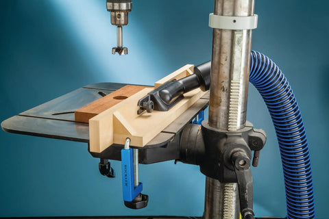 Dust Right Port for Drill Press Fence Portable Dust Collection Attachment in use, showing upward angled sawdust system setup