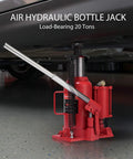 Front-left view of red 20-ton air-hydraulic bottle jack with long pump handle under a vehicle