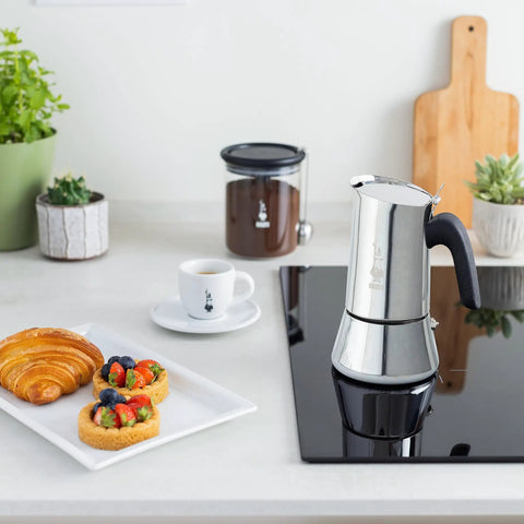 New Venus Induction Stovetop Coffee Maker 6 Cup Stainless Steel Silver on induction cooktop in modern kitchen setting