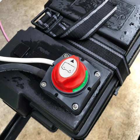Beefy Heavy Duty Battery Switch 12 to 48 Volt Waterproof Master Disconnect Isolator for Cars Trucks RVs and Boats On Off Power Cut Switch with 275A Continuous at 12V and 1250A Peak installed on a black battery case