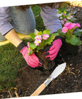 Ergonomic Hand Shovel for Gardening, No-Fuss Grip, Dig Deep Spade, plant transplanting next to blooming flowers