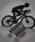 Dual Length Black Bike Handlebar Grips For Twisting Shifters with a silhouette of a cyclist in the background