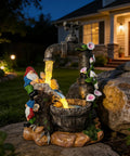Solar Garden Gnomes Statues With LED Water Fountain 10 Inch Resin Outdoor Yard Decor near house entrance at night