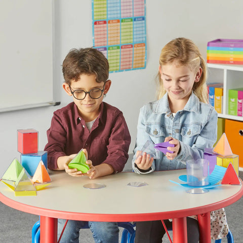Children using Foldable 3D Geometry Shapes Set for Classrooms at a round table, exploring geometry manipulatives and spatial reasoning tools.