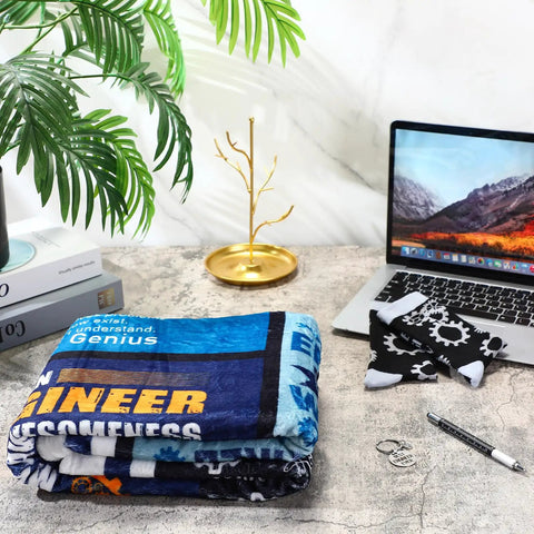 Engineer Appreciation Gift Set With Blanket, Multi Tool Pen, Keychain And Socks For Men displayed on a desk.
