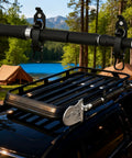 Heavy Duty Stainless Steel Shovel And Axe Holder Mount For Pickup Truck Bed And Roof Rack With Quick Release Rubber Clamps Hella Tight Offroad Rig Gear Black 4 Piece Kit mounted on truck roof rack.