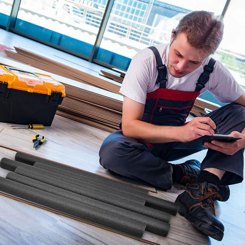 Pro Grade Foam Backer Rods 12 Pack For Expansion Joints, black foam rods on floor with workman reviewing plans.