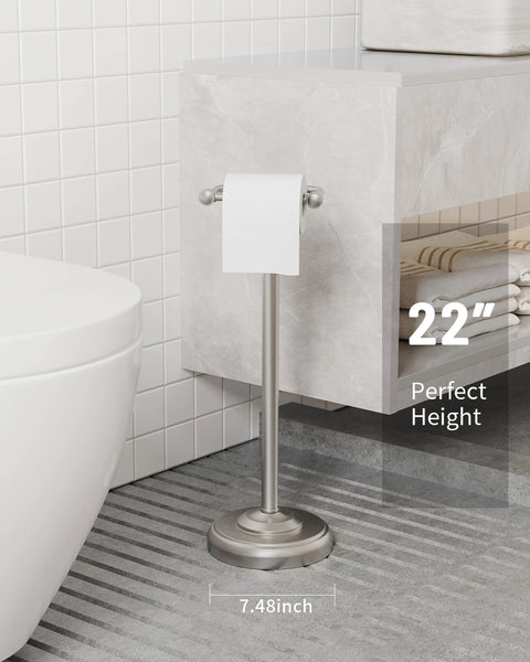 Free Standing Toilet Paper Holder With Pivoting Post, Brushed Nickel Finish, next to bathroom wall, measures 22 inches, supports mega roll