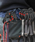 Person carrying Heavy Duty Auto Lock Carabiner Clips 28KN 6172Lbs Aluminum 4 Pack clipped on harness.