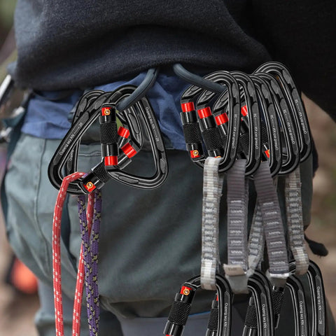 Person carrying Heavy Duty Auto Lock Carabiner Clips 28KN 6172Lbs Aluminum 4 Pack clipped on harness.