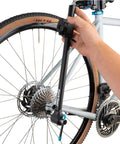 Person using DAG 3 Derailleur Hanger Alignment Gauge Must Have For Bikes Black With Low Profile Head Fits 16 To 29 Plus Wheels And Low Clearance