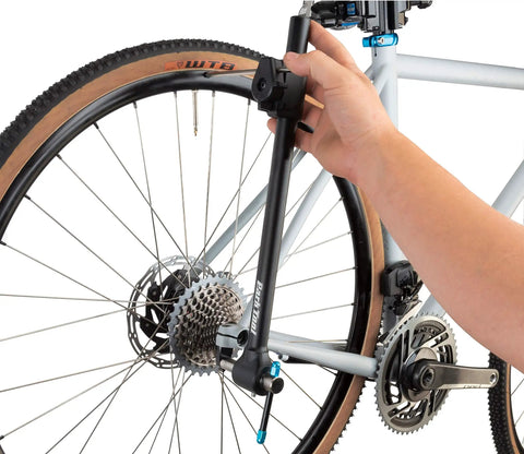 Person using DAG 3 Derailleur Hanger Alignment Gauge Must Have For Bikes Black With Low Profile Head Fits 16 To 29 Plus Wheels And Low Clearance
