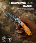 Hand holding Damascus Pocket Knife 76-Layer Blade VG-10 Core Folding Knife For Camping And Outdoor Adventures in forest