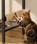 Cat using the scratching post on a Four In One Cat Furniture Stand With Scratching Post Dual Feeding Bowls Cozy Bed Platform And Built In Storage Organizer For Small Spaces Matte Black Cat Tower That Dope Setup Adds Serious Space Savings And Cat Happiness.