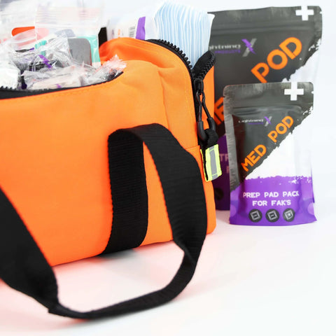 Lightning X value compact medic bag, orange with black strap; front view shows basic fill kit.