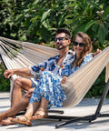 Couple relaxing on Double Hammock With 9 Ft Space Saving Steel Stand Includes Carrying Case Weather Resistant Cotton Super Cozy