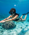 Person snorkeling with Thermal Neoprene Hood Cap For Freediving And Sea Swimming With Adjustable Chin Strap Beanie Hat Black Large offers warmth