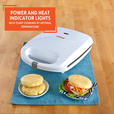 Imusa 4 Slot Electric Arepa Maker, 1200 Watt Nonstick Griddle For Fluffy Corn Cakes with cooked corn cakes and lettuce sandwich.