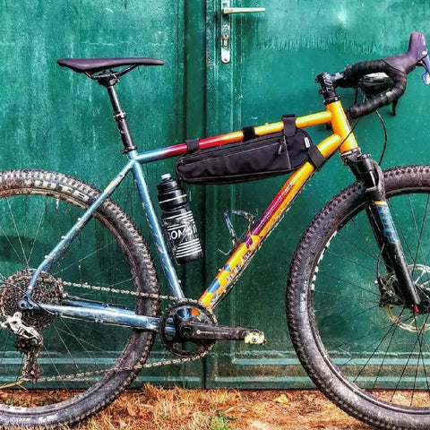 Bike with Long John Frame Bag For Bikes With Dual Duty Top Tube And Frame Storage, Side Zippers For Easy Access At Any Angle.