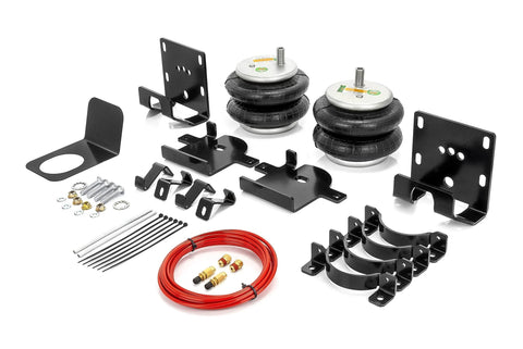 TORQUE rear airbag suspension kit with two air springs, black mounting brackets, and red air line.