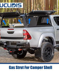 Heavy Duty Gas Strut Lift Support For Truck Camper Shell Topper Cap And Tool Box Hella Tough Tension Compatible With Leer And Snugtop Models Set Of Two installed on a silver pickup truck with open lids.