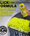 Ultimate Car Wash Bucket Kit with Dirt Trap Insert, microfiber mitt, and soap being used on a foamy car surface.