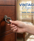 Vintage Antique Drawer Pulls and Knobs Set in Oil Rubbed Bronze With Classic Ring Handles being used on wooden furniture