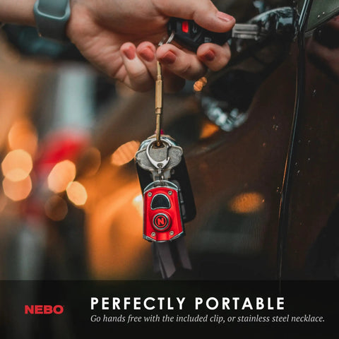 Person holding keys with attached Mycro Keychain Flashlight 400 Lumen Rechargeable EDC Light With 6 Red Green White Modes.