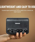 Hand holding Beast 10W Mini Guitar Amp For Bedroom Practice Portable All-In-One Bluetooth Amp with Clean and Overdrive Modes.