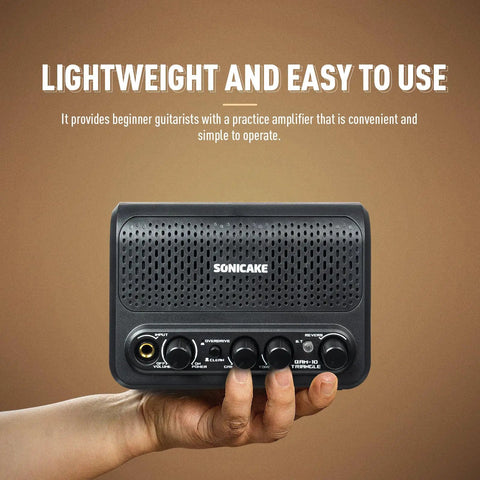 Hand holding Beast 10W Mini Guitar Amp For Bedroom Practice Portable All-In-One Bluetooth Amp with Clean and Overdrive Modes.