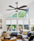 52" 5PCS Solid Wood Blades Ceiling Fan with Lights Remote Control, Nickel hanging in a bright living room with windows.