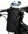 Rock Solid Insulated Bike Cup Holder For Epic E-Bike Offroad MTB Rides Keeps Your Drink Ice Cold Or Scalding Hot With Thick Foam Protection During Wild Adventures And Camp Tours Leak Proof Gear mounted on black bike handlebars