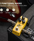 Close-up of Golden Horse Overdrive Tone Pedal For Electric Guitar With True Bypass Two Voice Modes on amplifier.